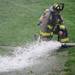 An Ann Arbor firefighters attends to a hose that came apart during a training exercise at Parkhurst Apartments on Wednesday. Melanie Maxwell I AnnArbor.com 